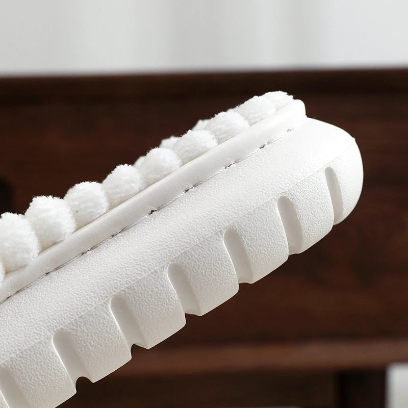 Close-up of a white foam roller on a kawaii slipper.