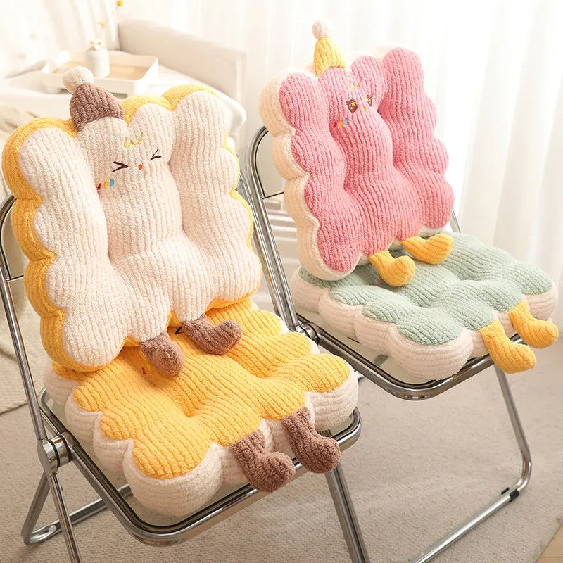 Two knitted kawaii cushions with cartoon characters on a metal chair.