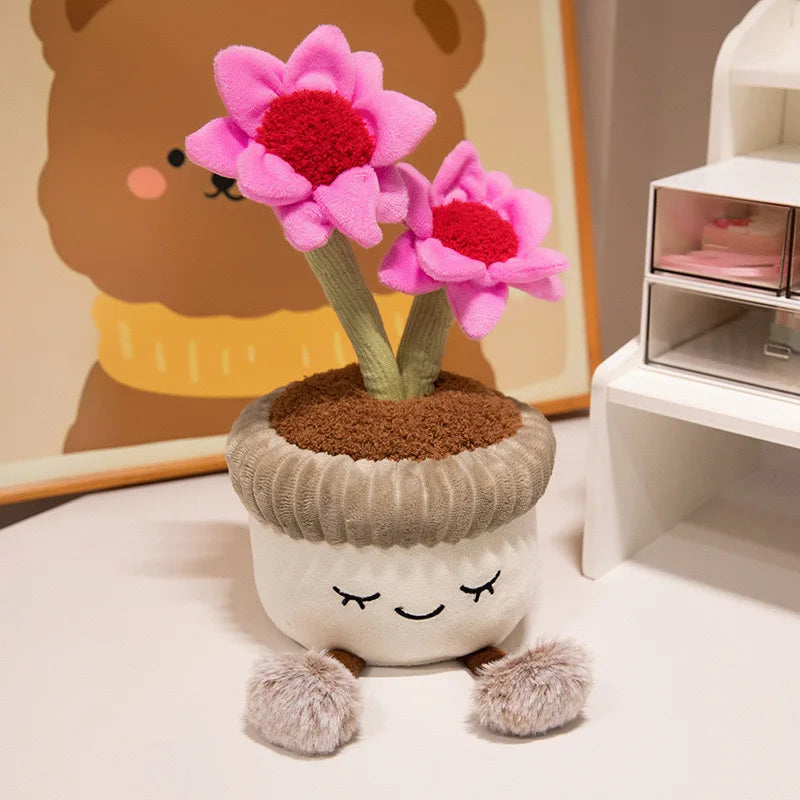 Plush kawaii flower pot with pink flowers and a smiling face on a surface.