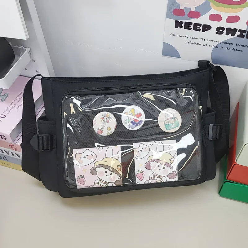 Black Kawaii crossbody bag with cartoon designs on a white surface