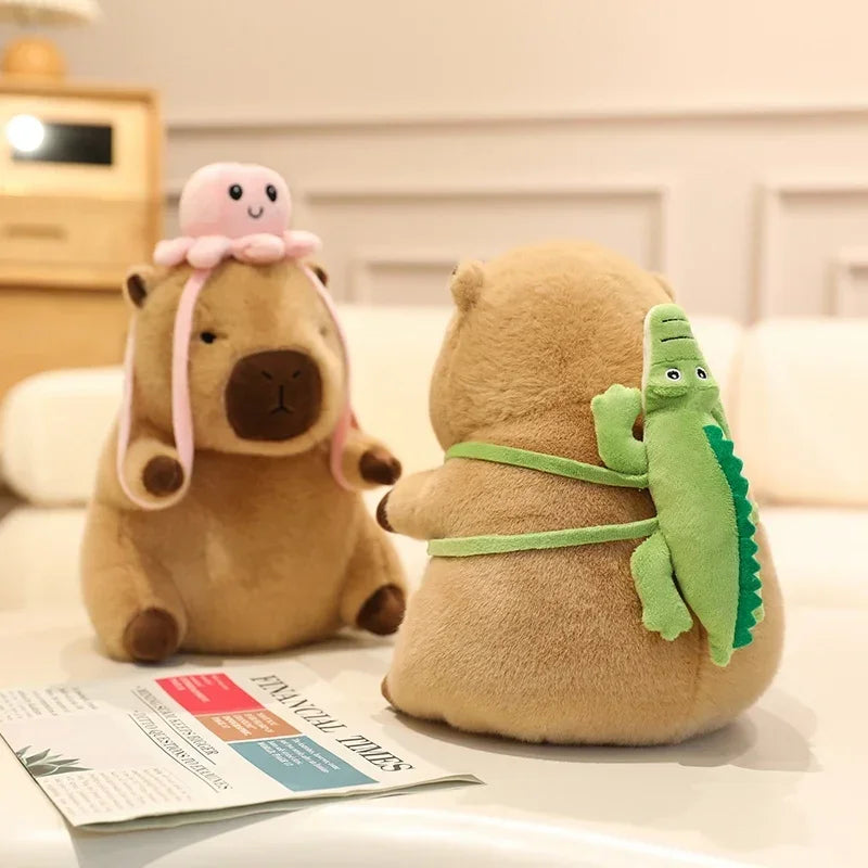 Two kawaii plush toys, one with a pink octopus and the other with a green crocodile, sitting on a surface.