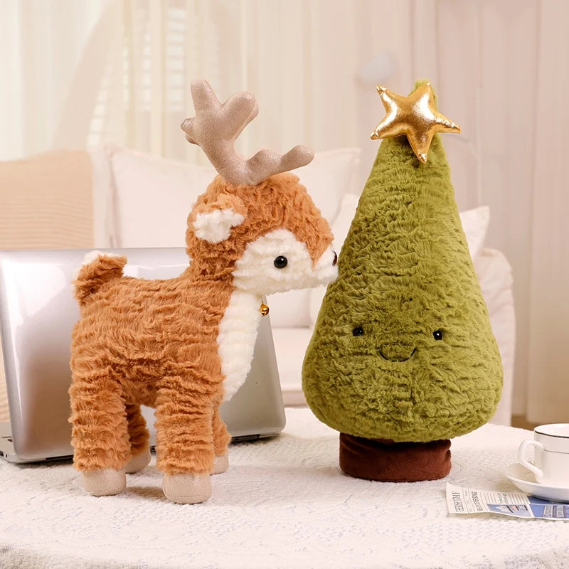 Plush deer and Christmas tree kawaii toy on a table with a neutral background