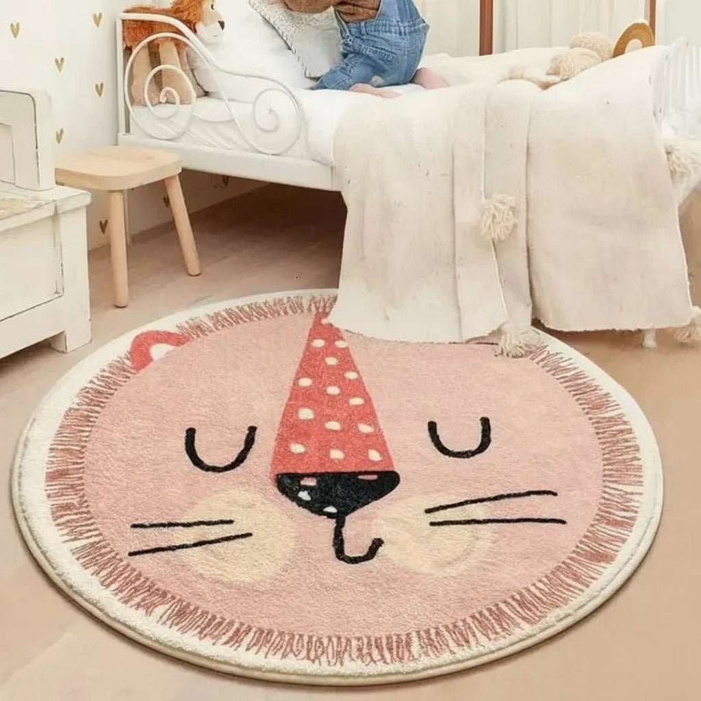 Round pink cat-shaped kawaii rug on a beige floor with 'vikama' branding.