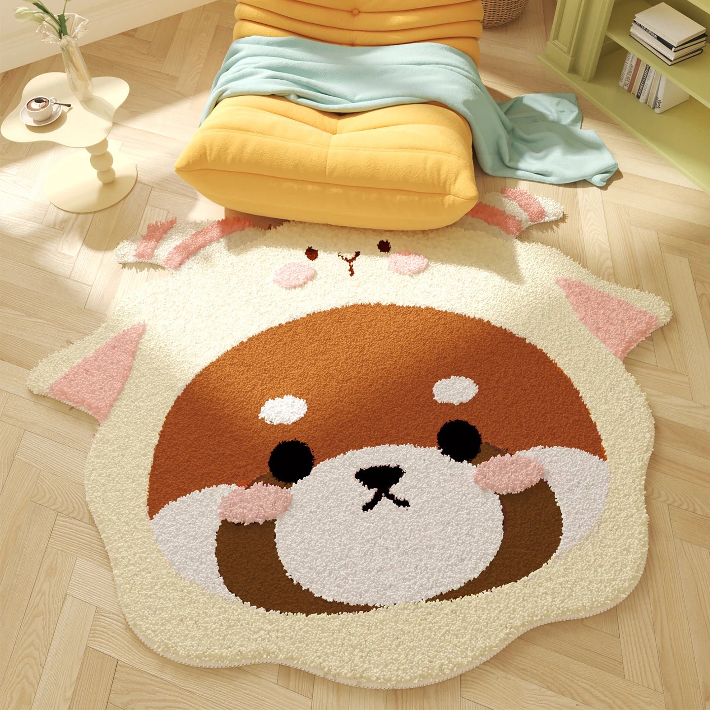 Cute animal-shaped kawaii rug on a wooden floor with a yellow cushion and books in the background.