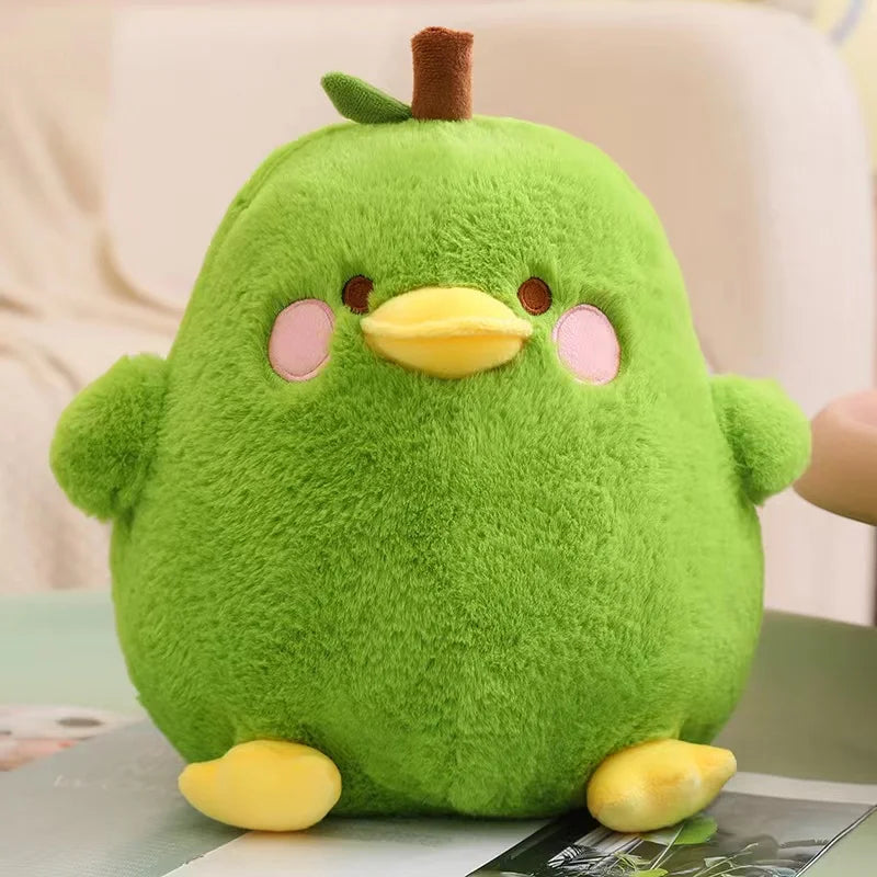 Green kawaii plush toy resembling a bird on a magazine
