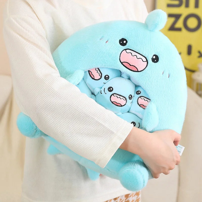Person holding a blue kawaii plush toy with bear design