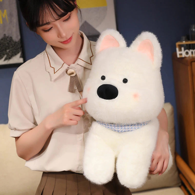 Person holding a large white kawaii plush dog toy in a room with a blue wall.