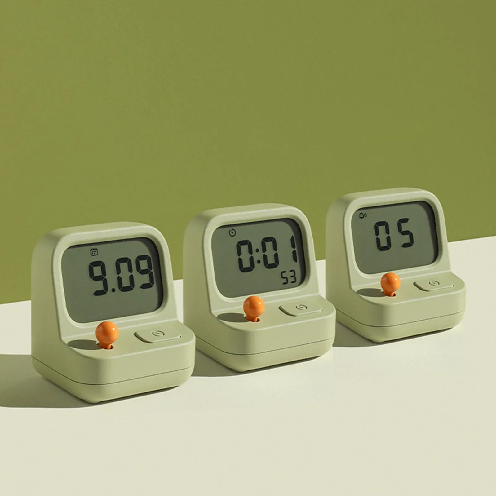 Three green kawaii digital timers on a light green background