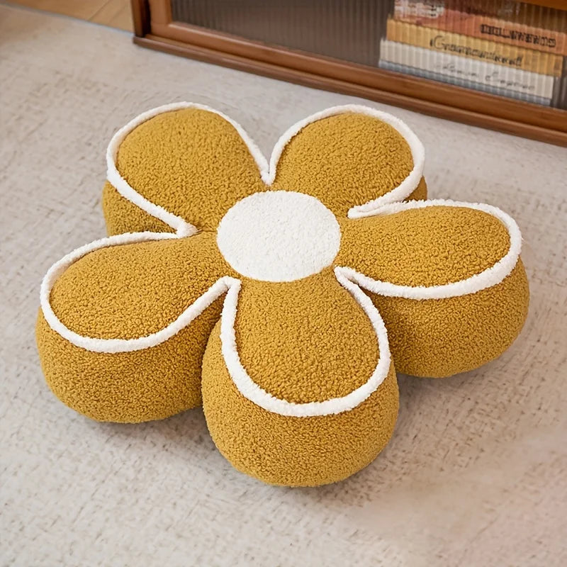 Yellow flower-shaped kawaii cushion on a carpeted floor