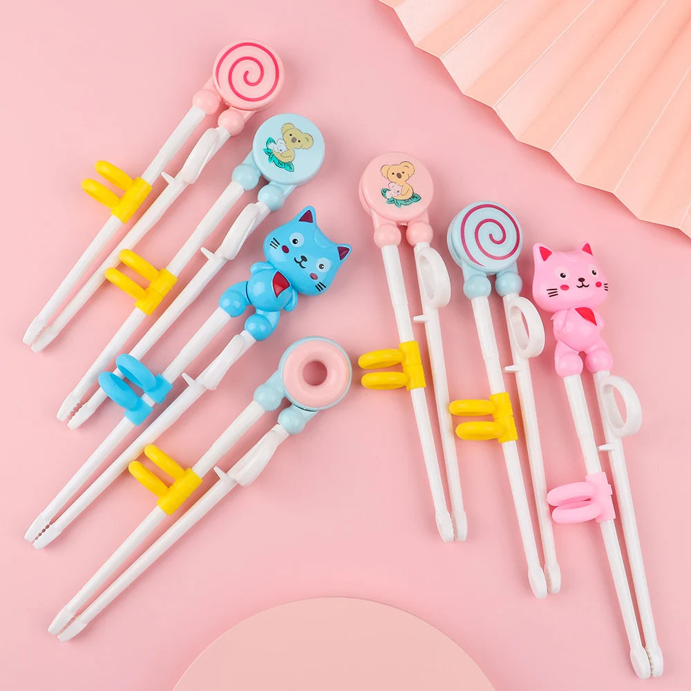 Set of kawaii cartoon-themed chopsticks with colorful holders on a pink background