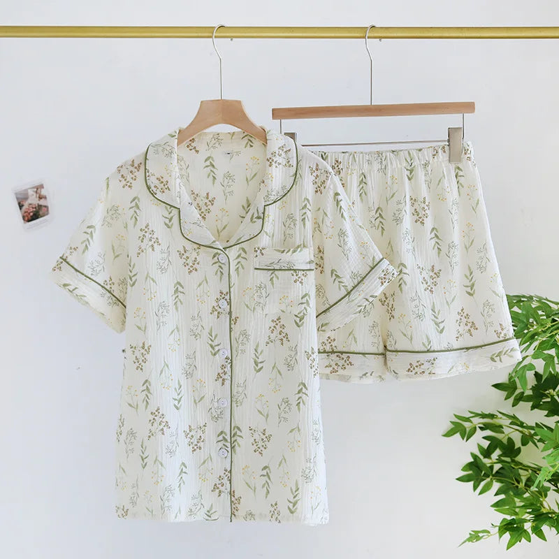 Floral kawaii pajama set hanging on a rack with a plant in the corner