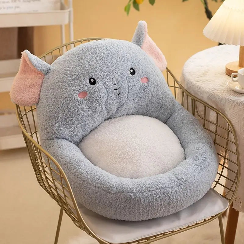 Plush elephant kawaii cushion on a chair in a home setting