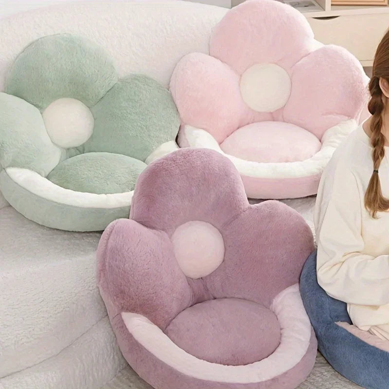 Flower-shaped kawaii cushion chairs in pastel colors with a person sitting on one.