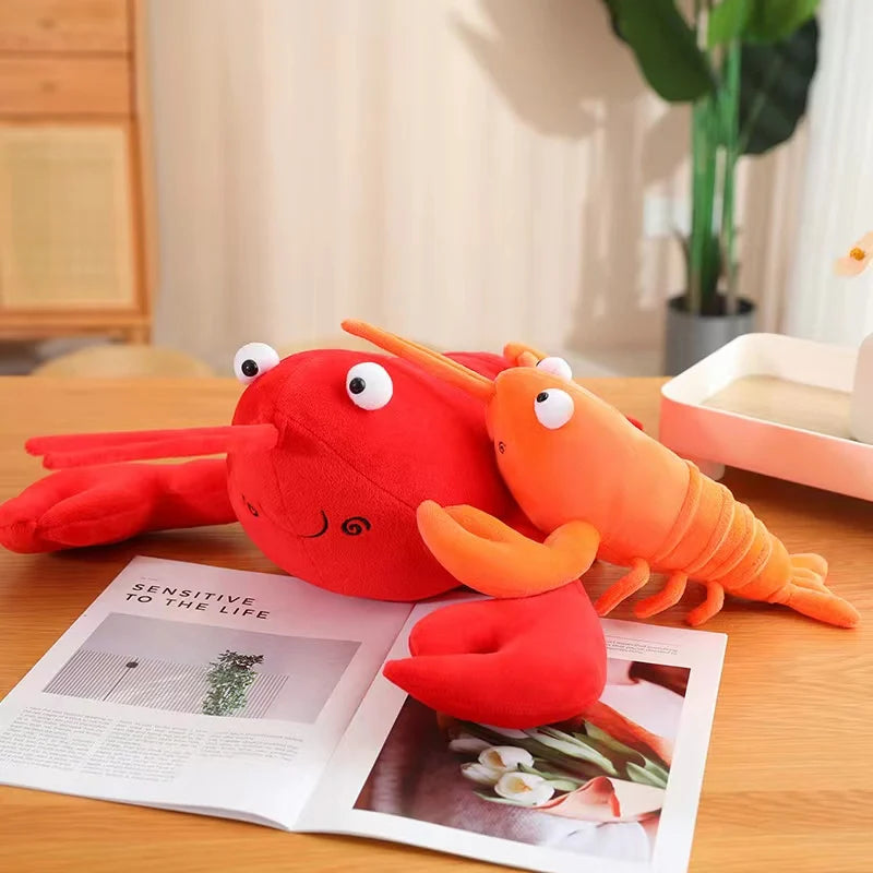Kawaii plush toy lobster on a table with an open magazine