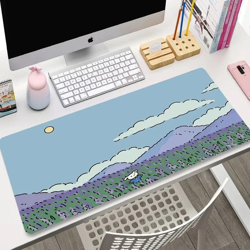 Desk setup with a large mouse pad featuring a Kawaii scenic design.
