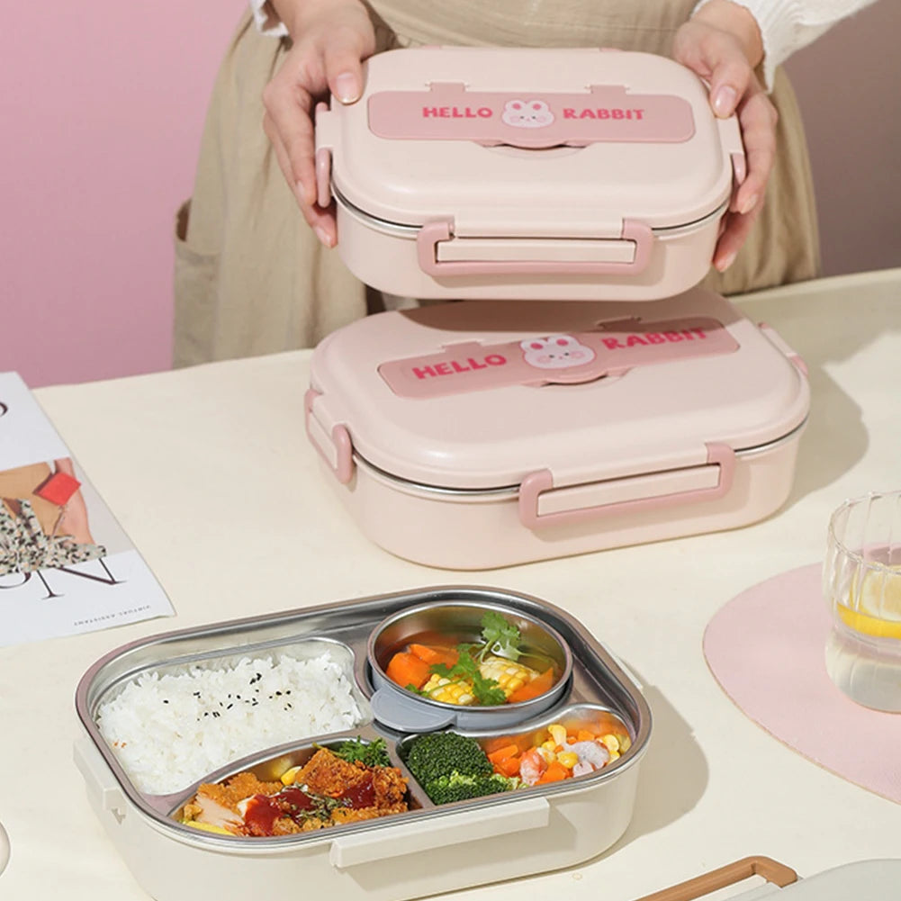 Pink kawaii 'Hello Rabbit' bento box with food compartments on a table.
