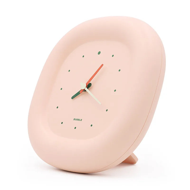 Pink kawaii clock with a white face on a white background
