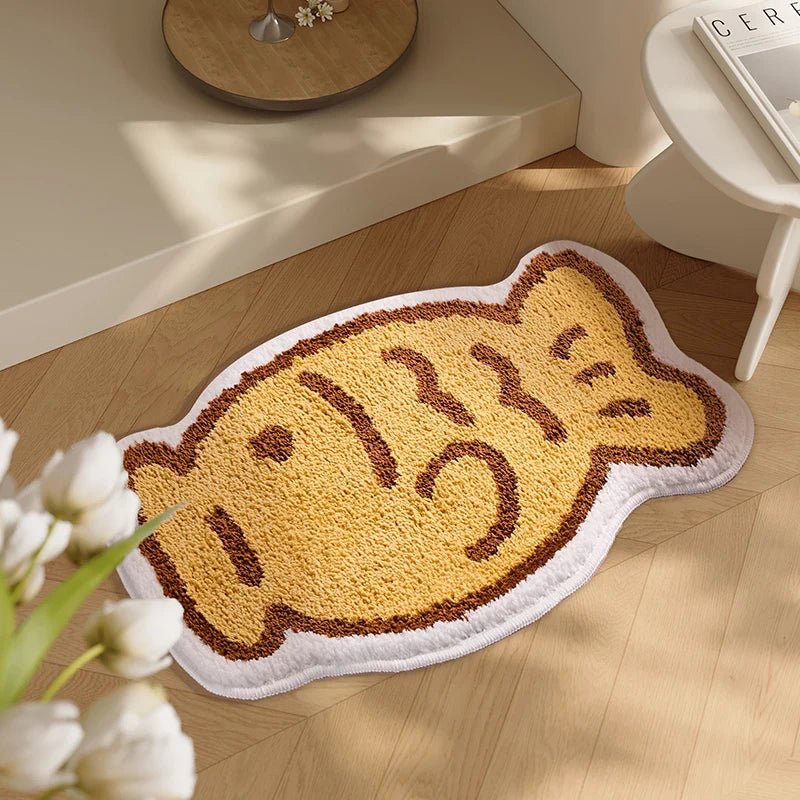Cat-shaped kawaii rug on a wooden floor with flowers in the foreground