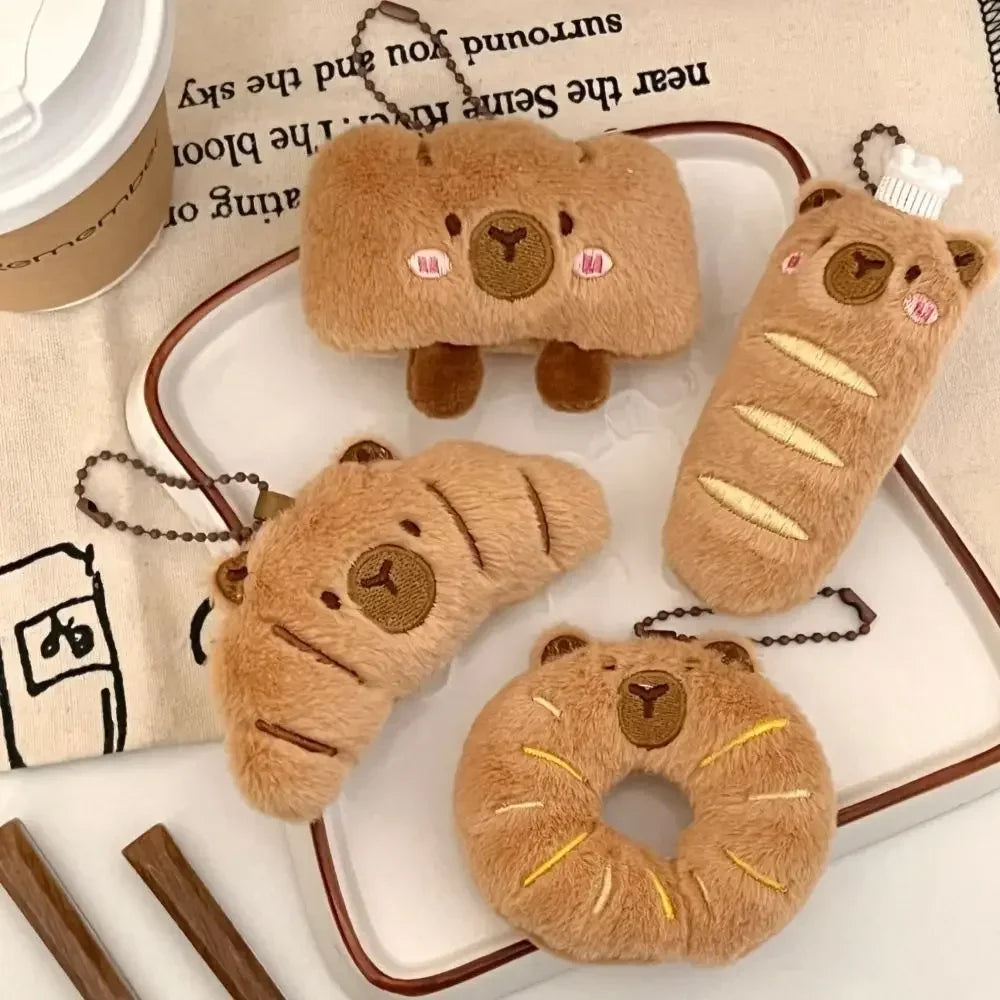 Set of kawaii bear-themed keychains and pouches on a white surface with a book in the background.