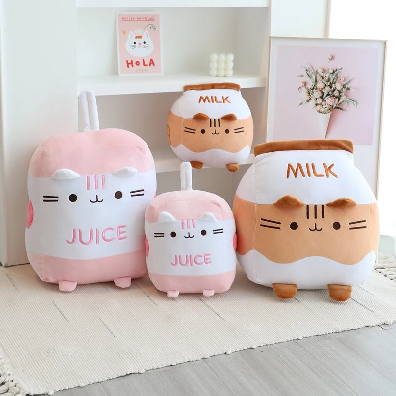 Set of cute kawaii plush toys resembling milk cartons and juice bottles on a light wooden floor.