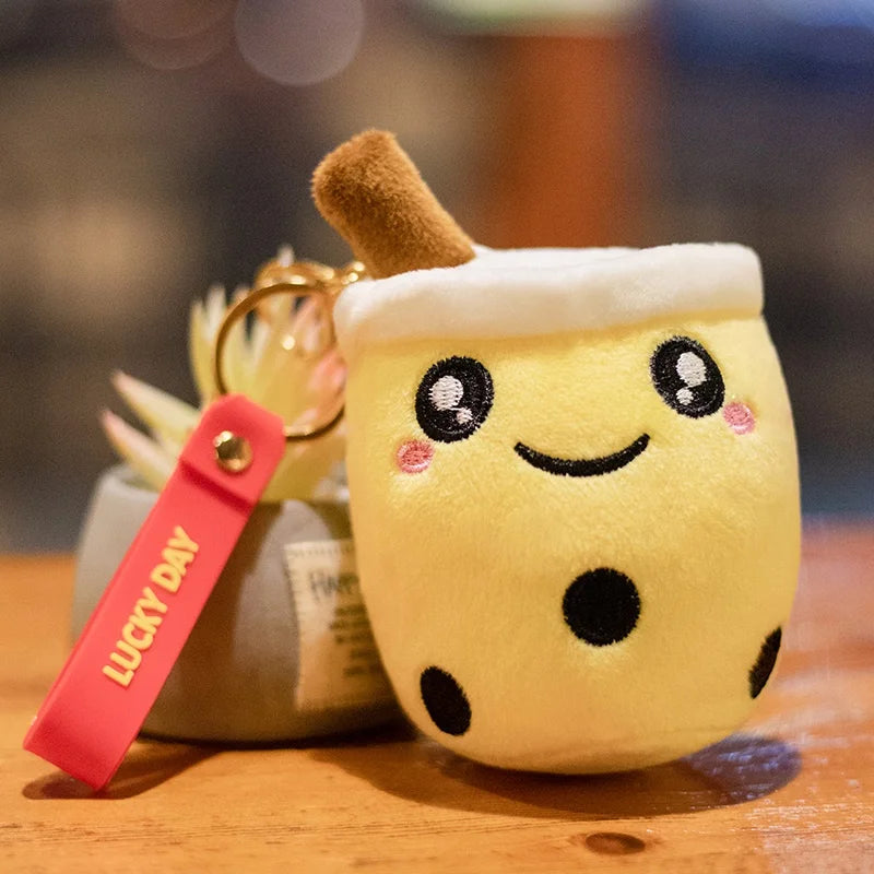 Kawaii plush toy resembling a bubble tea with a 'Lucky Day' tag on a wooden surface.