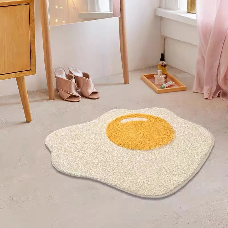 Egg-shaped kawaii rug with yellow center on a light gray floor, next to a wooden cabinet and mirror.