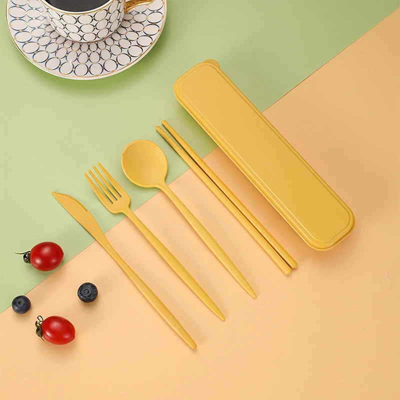 Yellow kawaii cutlery set with a case on a green and beige background