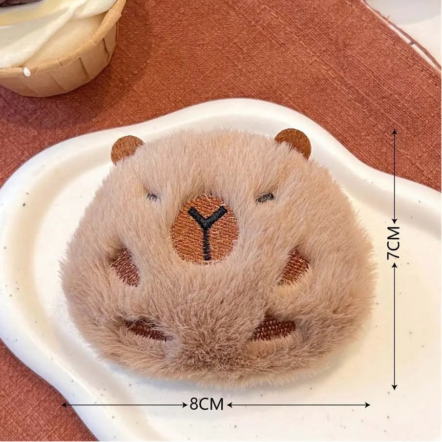Small kawaii plush bear toy on a white stand with measurements indicated