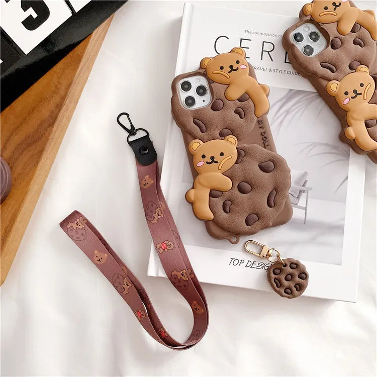 Phone case with kawaii bear design and lanyard on a magazine
