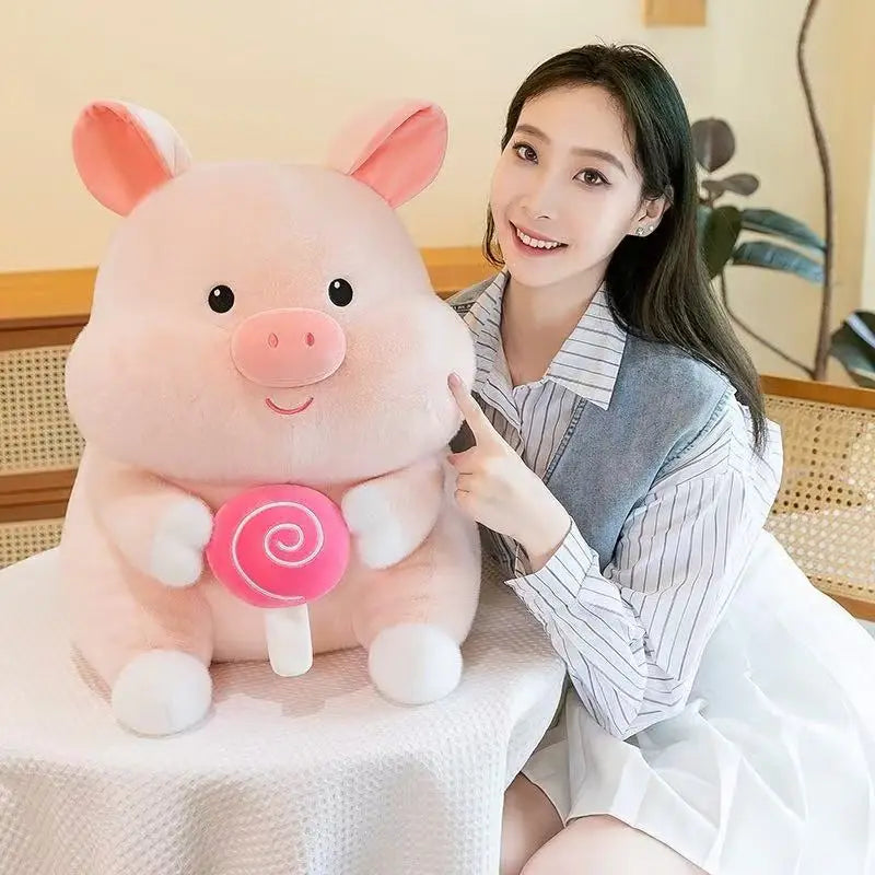Woman holding a large pink kawaii plush pig toy indoors