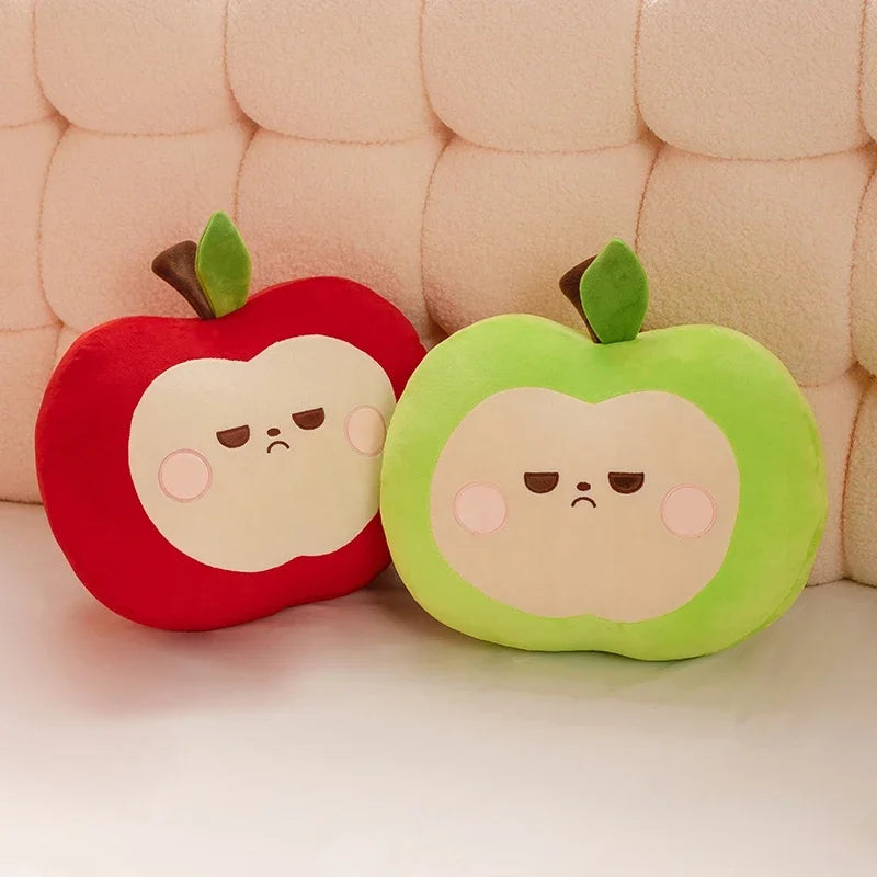 Two kawaii plush apple toys with sad faces on a textured pink background