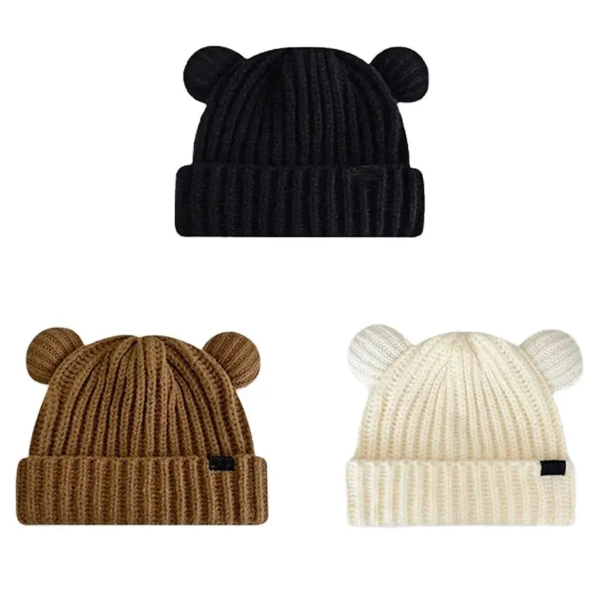 Three knit Kawaii hats in black, brown, and beige with bear ear designs on a white background.