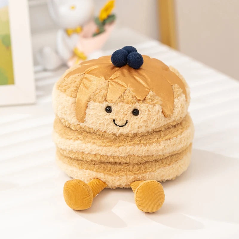 Plush kawaii toy resembling a layered dessert with a face on a white surface