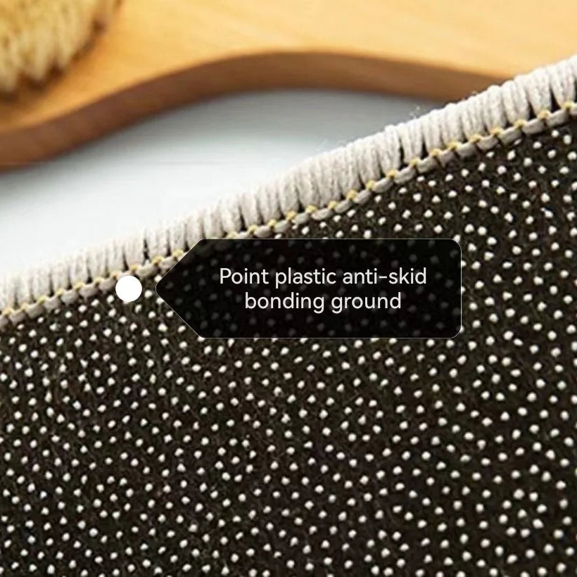 Textured surface of a kawaii-style rug with anti-skid bonding ground label and wooden object in the background