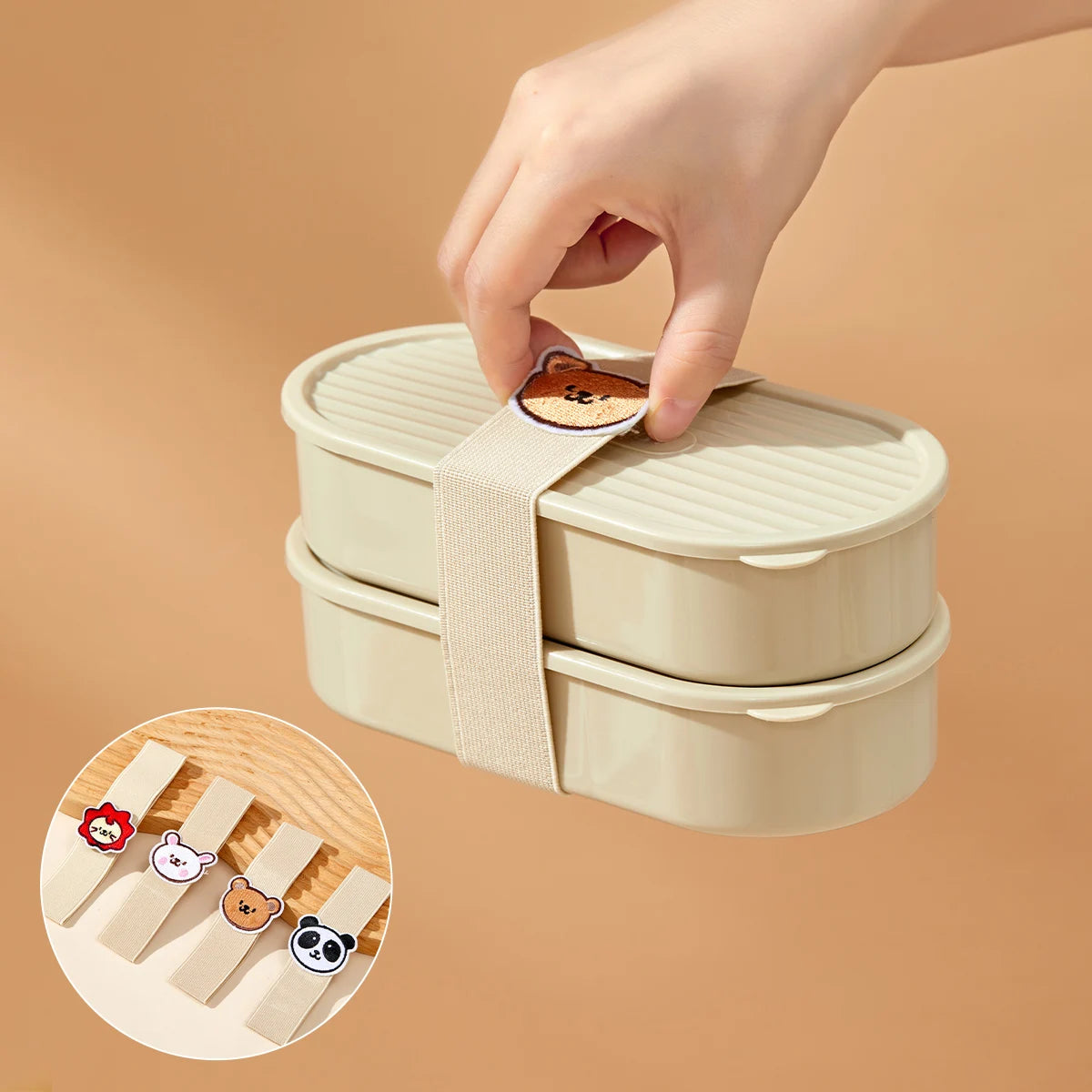Kawaii beige bento box with a hand placing a decorative clip on a beige background