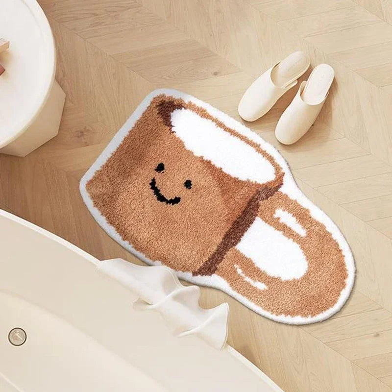 Cute Kawaii cartoon-style bath mat on a wooden floor with slippers nearby
