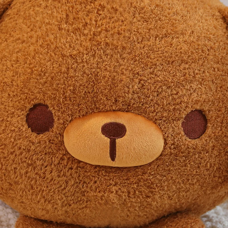Close-up of a brown kawaii plush bear with a soft texture.