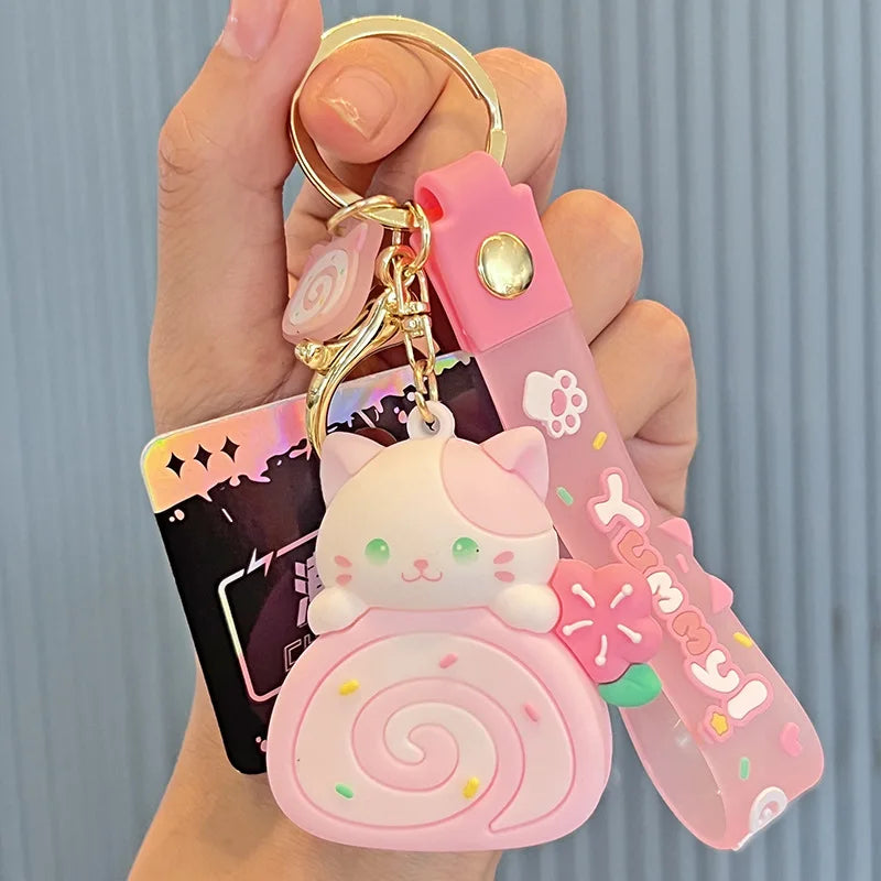 Pink cat-shaped kawaii keychain with a card holder on a neutral background