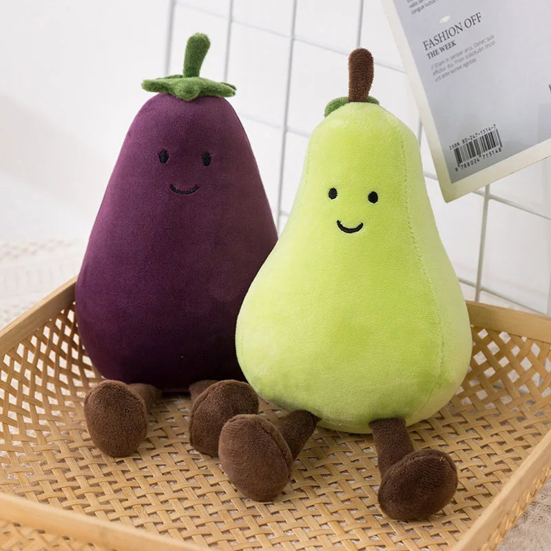 Plush kawaii toys shaped like an eggplant and a pear on a woven surface.