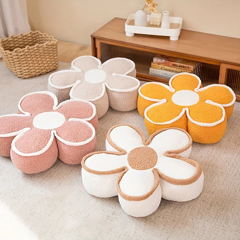Flower-shaped kawaii cushions in various colors on a carpeted floor.