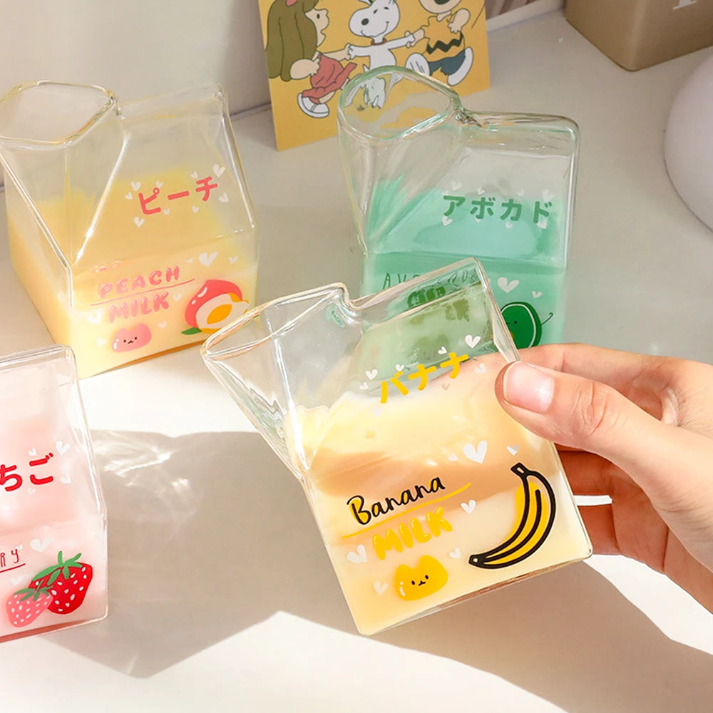 Clear pouches with Kawaii designs and text, held by a hand on a light background