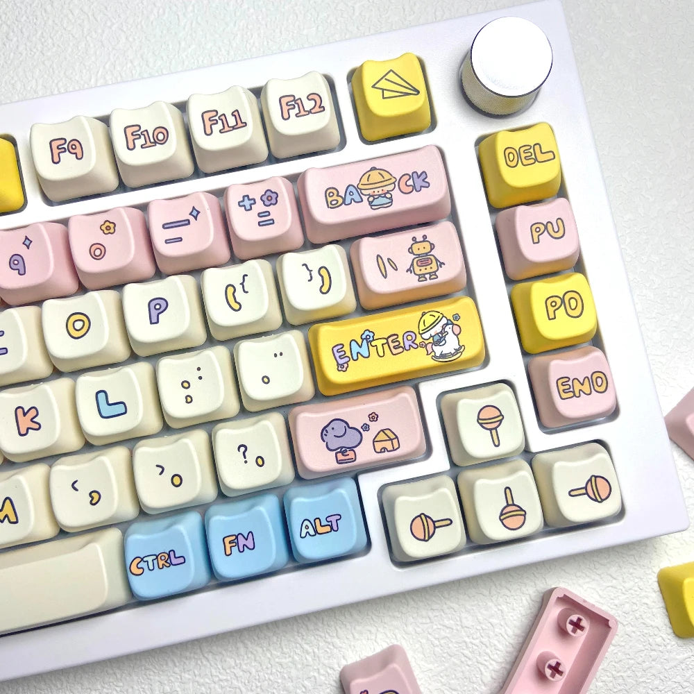 Colorful keyboard with Kawaii cartoonish keycaps on a white background