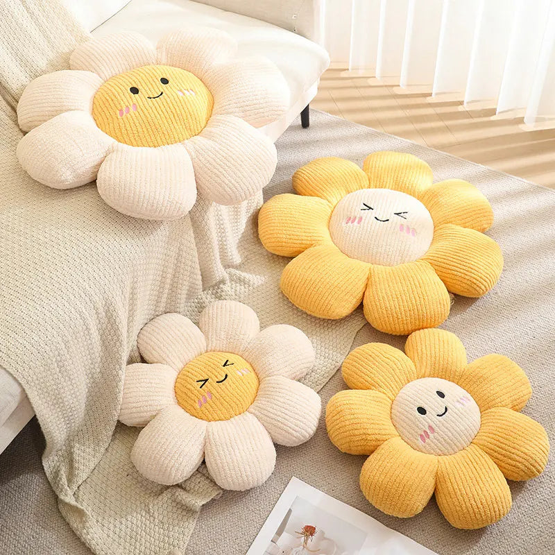 Set of sunflower-shaped kawaii plush toys on a soft surface