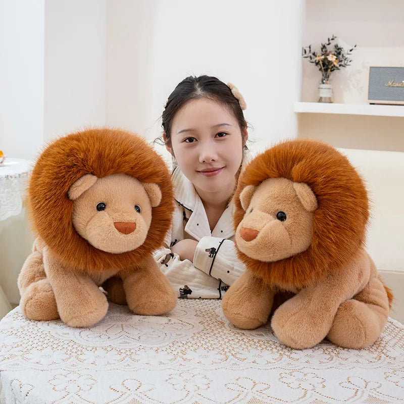 Person sitting between two kawaii plush lion toys on a table.