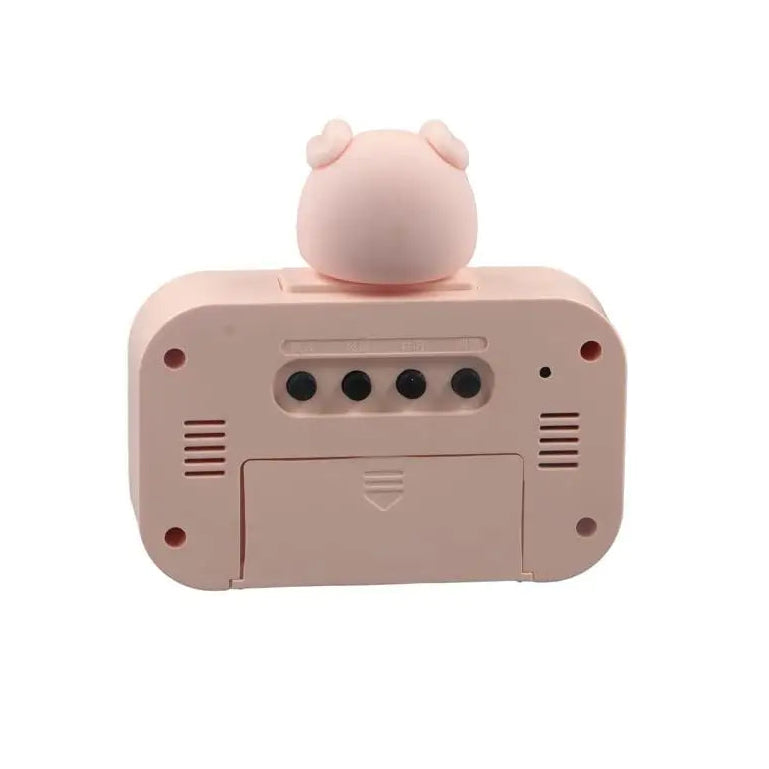 Pink kawaii toy with a bear-like figure on top against a white background