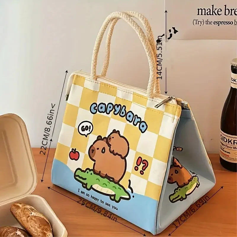 Kawaii capybara-themed lunch bag with measurements on a wooden surface