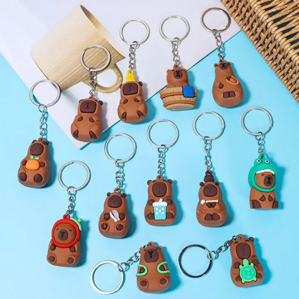 Collection of kawaii bear-shaped keychains on a blue background