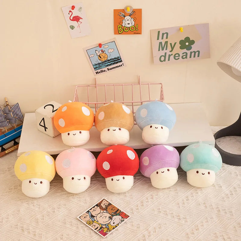 Colorful mushroom-shaped plush kawaii toys on a shelf with decorative items in the background.