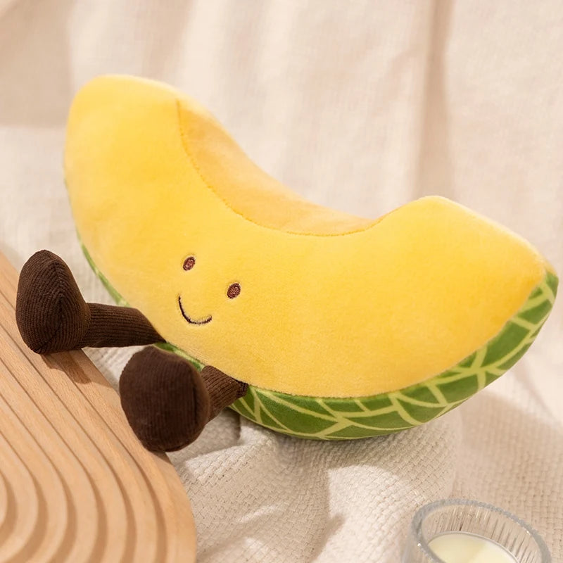 Plush kawaii toy shaped like a banana with a smiling face on a neutral background