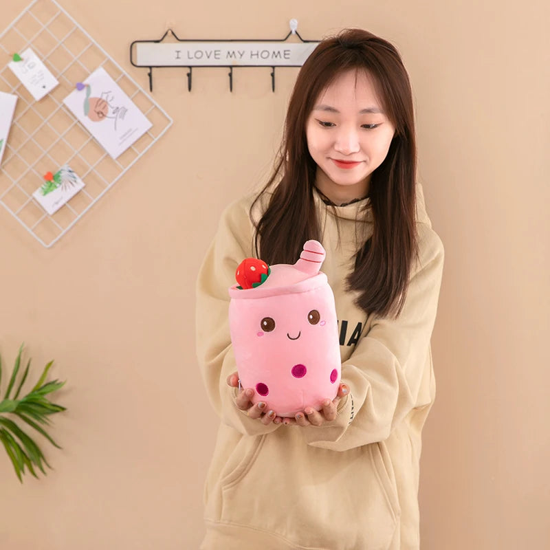 Woman holding a boba tea kawaii plush toy